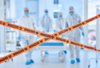 Buy stock photo Medical doctors in a covid protected room. Biohazard team behind quarantine tape barrier. Biologist colleagues working in prohibited hospital room. Doctors dealing with disease disaster together