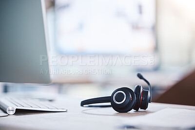 Buy stock photo Call center, customer service and headset and computer on a desk in an empty office space. Crm, telemarketing and sales or technical support company with headphones for help desk consultation