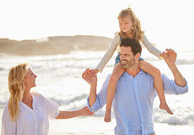 Buy stock photo Closeup of a caucasian man spending time at the beach with his cute little daughter and wife. Male carrying his daughter on his shoulder while walking with his wife on the beach