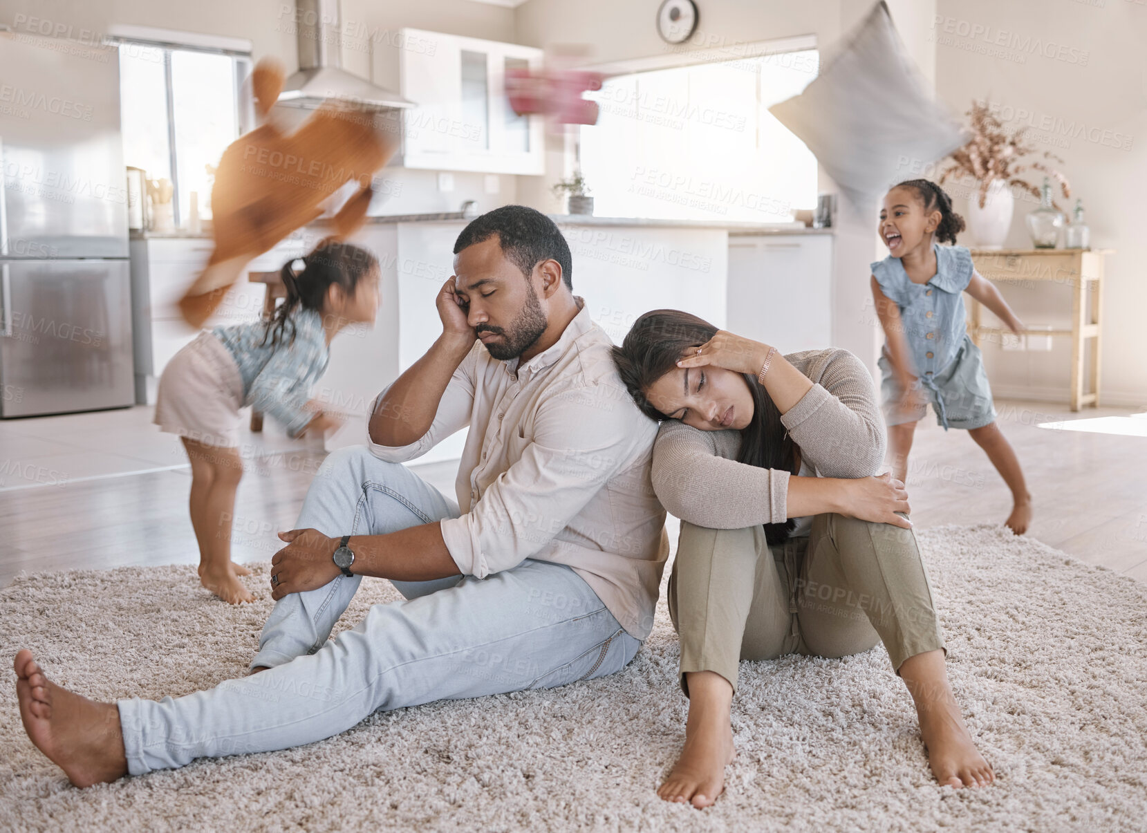 Buy stock photo Headache, blur and parents with children in home, playing game or family tired of noise. People, mother and father with stress for chaos, adhd or energy of hyperactive kids with motion on floor