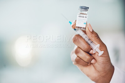 Buy stock photo Covid, vaccine and medicine with the hand of a doctor holding medication and working in a hospital. Medical, healthcare and insurance with a cure, treatment or dose in the hands of a nurse inside