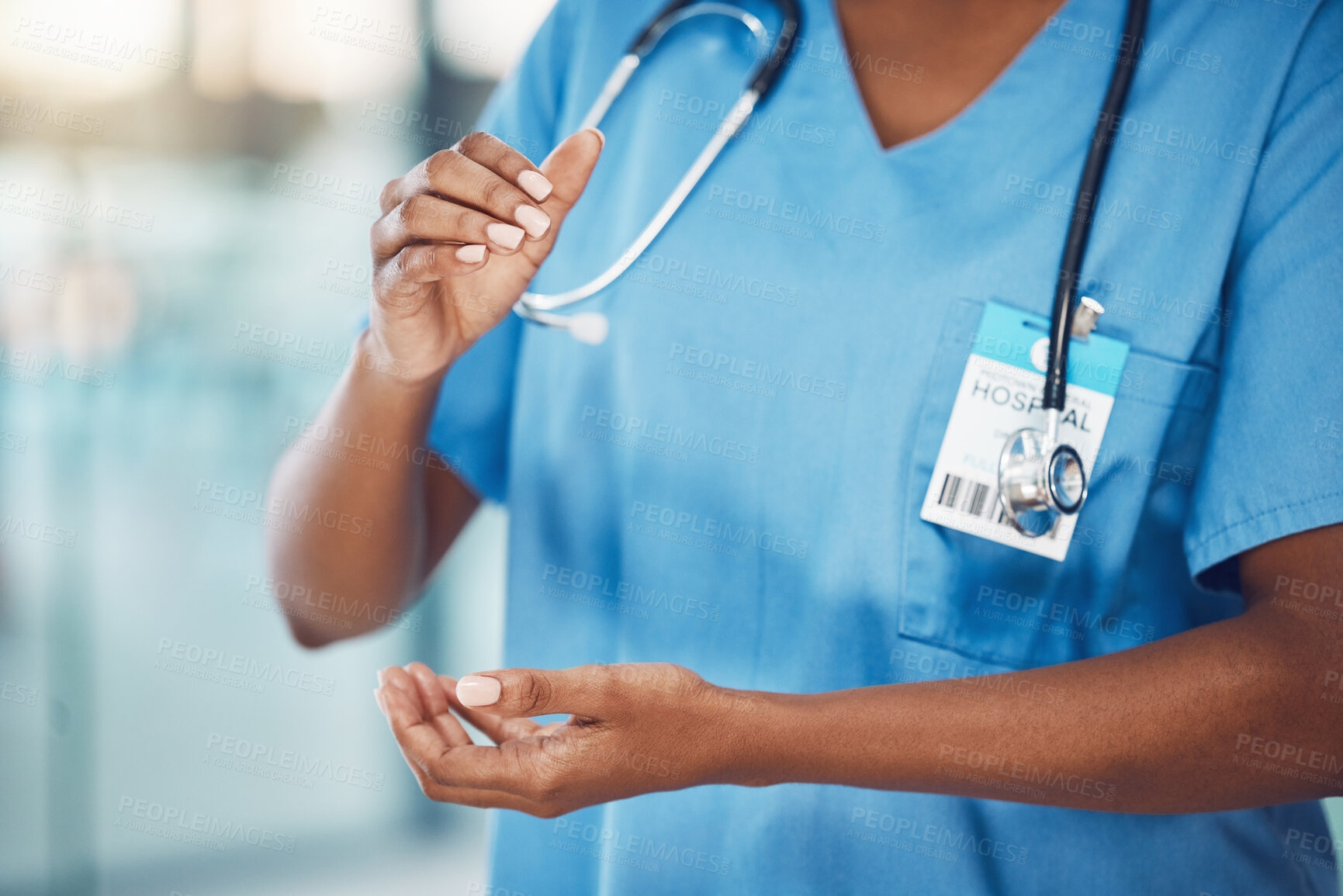 Buy stock photo Hands, healthcare and medicine with a woman nurse in scrubs working in a hospital for health and safety. Trust, care and medical with a female at work in a clinic for wellness, help and insurance 