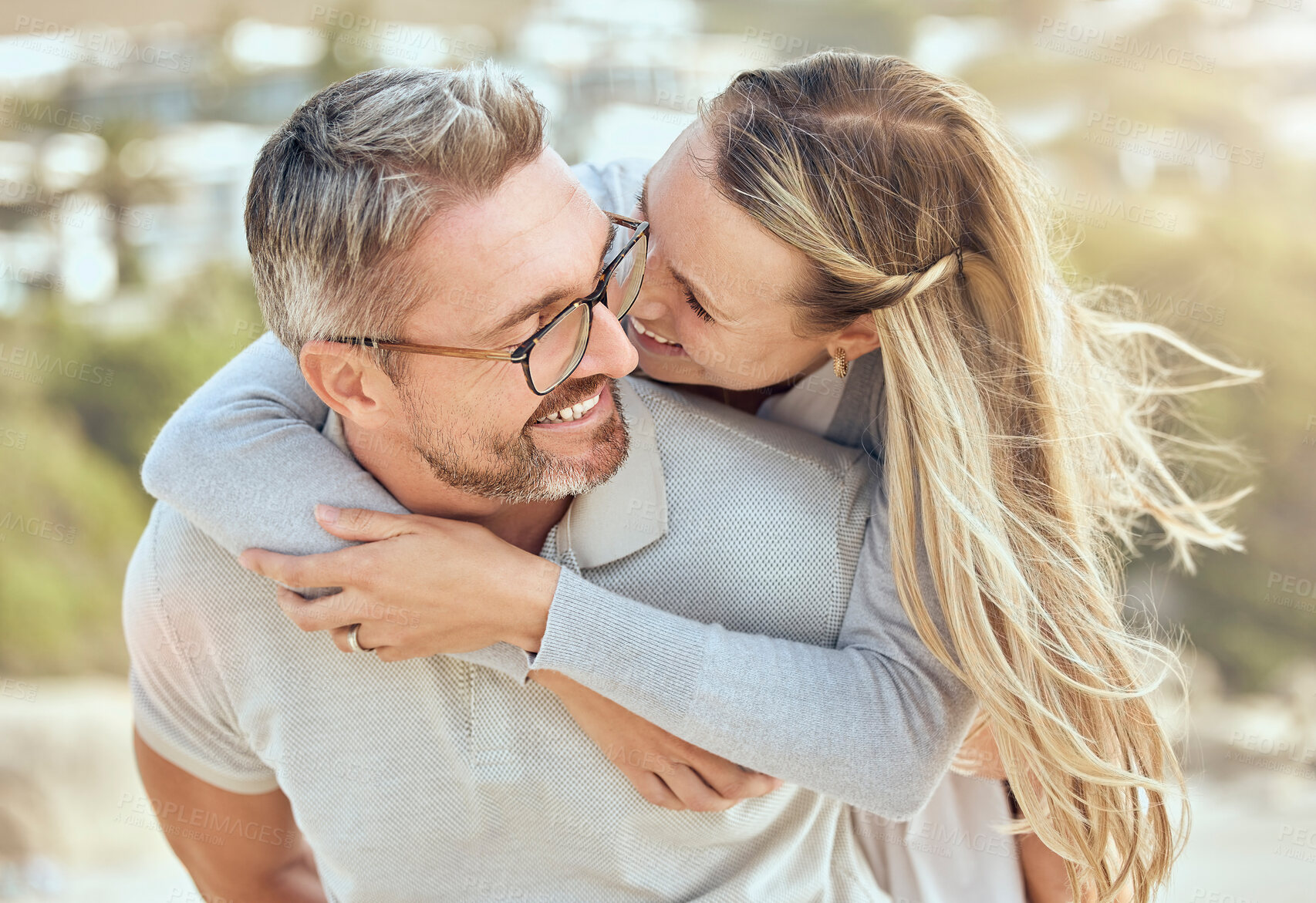 Buy stock photo Hug, love and couple with a smile, beach or romance with relationship, marriage or summer vacation. Romantic, mature man or woman embrace, seaside holiday or bonding with happiness or loving together