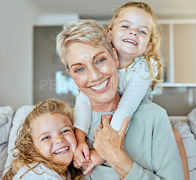 Buy stock photo Portrait of a multi generation family of three females only relaxing on the sofa together. Smiling granny babysitting her two granddaughters at home