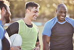 Group of diverse rugby players standing in a huddle during training after a practice match outside on a field. Working on their gameplan for the upcoming game. Happy teammates enjoying playing sport