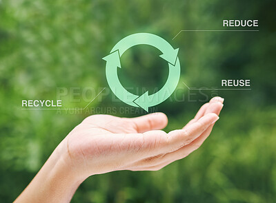 Hand holding a digital recycle symbol. A digital recycling symbol hovering over a hand. Using technology to recycle, reuse and reduce waste.
