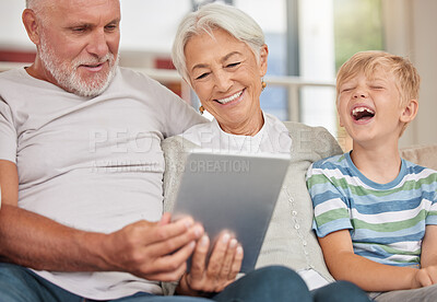 Buy stock photo A happy mature couple bonding with their grandchild while babysitting and using a digital tablet for video call at home. Grandparents relaxing with their cute little grandson and browsing