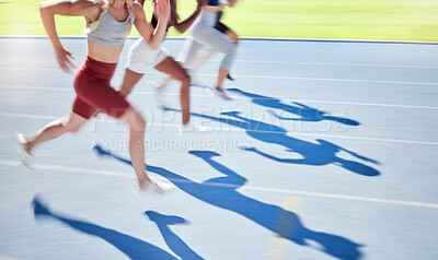 Buy stock photo Shadow of athletes running and racing together on a sports track. Closeup of active and fit runners sprinting or jogging on a field. People exercising and training their fitness and cardio levels