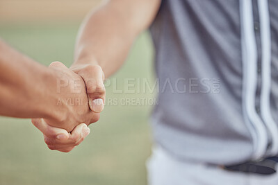Closeup of two sportsmen shaking hands before a game. Baseball players congratulating each other after winning a match. Two unknown male competitors wishing each other goodluck on the field