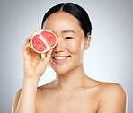 Beauty, skincare and grapefruit with portrait of woman for wellness, health and vitamin c cosmetics. Smile, fruit and natural makeup with face of asian girl for nutrition, luxury and  facial product
