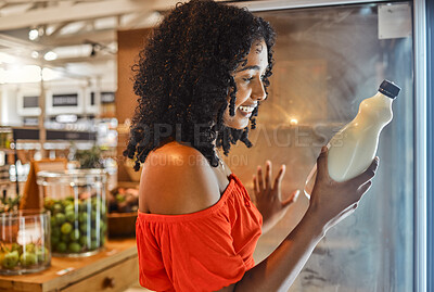 Buy stock photo Woman, grocery shopping or reading milk label for sales date, vitamin information or calcium data in Brazilian store retail. Happy smile, supermarket customer or nutritionist and dairy fridge product