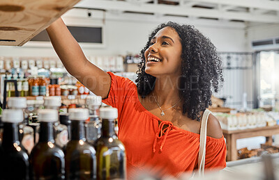 Buy stock photo Supermarket, shelf and shopping customer woman retail store for eco friendly product, olive oil or groceries choice. Happy woman in small business store marketplace with choice or food sale discount 