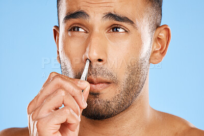 Buy stock photo Man, nose grooming and facial care beauty wellness treatment blue background in studio. Portrait of young male face, cosmetic body skincare healthy lifestyle and hand nasal hygiene personal care