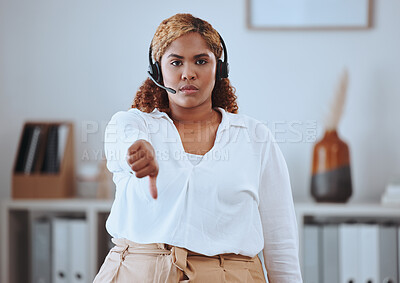 Buy stock photo Thumbs down from call center agent, annoyed and angry while wearing a headset. Portrait of a young woman feeling the pressure of a bad workplace, frustrated and unhappy at her job, work environment