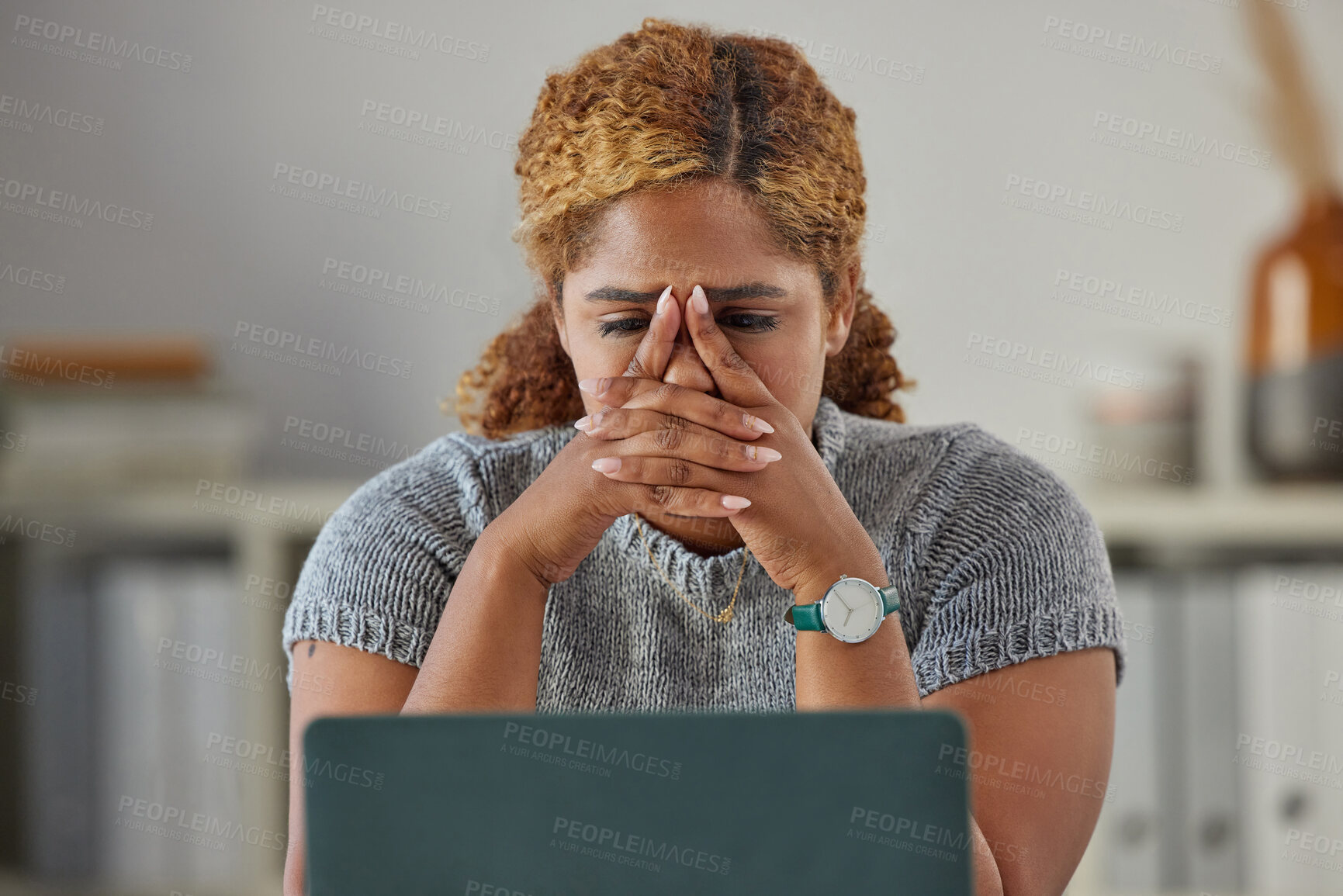 Buy stock photo Stressed, worried and upset business woman feeling anxiety and the pressure of deadlines at work. Young female looking unhappy or frustrated while working on a laptop at her desk in the office