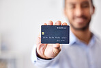 Buying, shopping and banking used with a credit card to making payment, orders or bank. One person holding, showing and displaying a debit card to use for purchasing items, retail therapy and paying