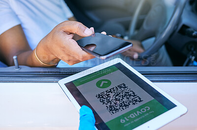 Buy stock photo Scanning qr code to permit travel during covid lockdown at a checkpoint, stop or border. Person holding phone to scan a corona passcode, barcode or password on a tablet at a vaccination site
