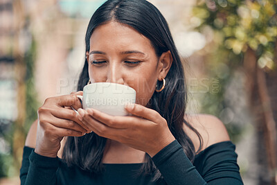 Buy stock photo Woman relaxing holding coffee in joy outside. Peaceful, calm and stressless female sipping a mug of tea in a cafe outside. Closeup of carefree lady enjoying a hot beverage in fresh air.