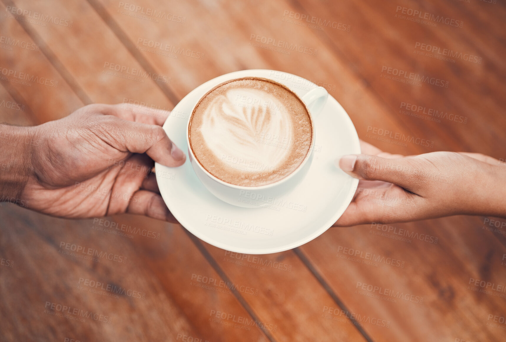 Buy stock photo Service, customer and serving coffee to a cafe client and giving a cup of hot and fresh drink with milk foam at coffeeshop. Closeup of hands holding cappuccino with beautiful cream of latte art