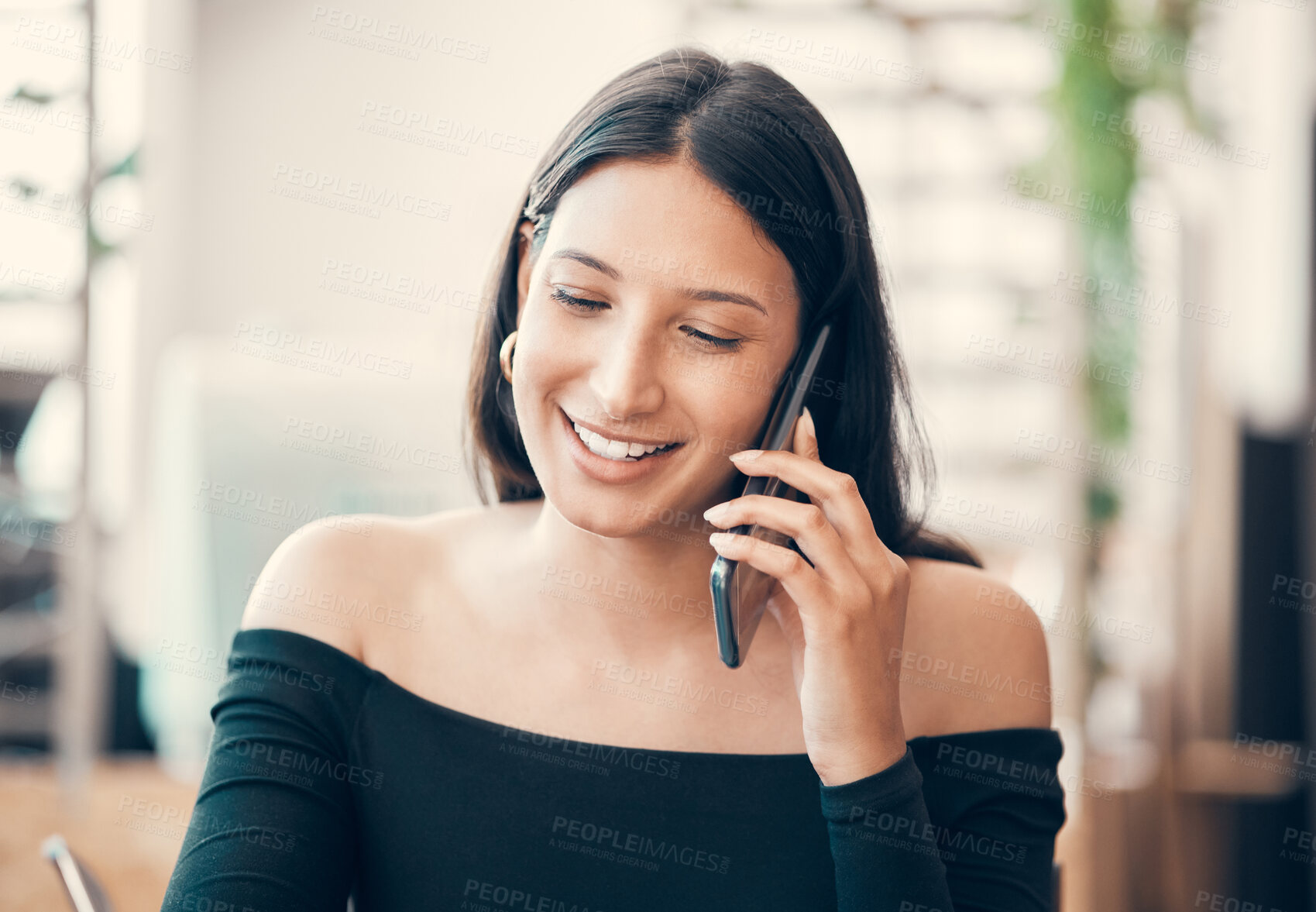 Buy stock photo Beautiful young woman talking on a phone call sitting alone at a coffee shop. Confident and friendly female flirting and smiling while calling someone outside a restaurant on a summer weekend