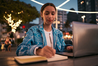 Buy stock photo Trendy, creative and smart student studying online with a laptop late at night at a modern campus. Young, inspired and motivated female writer or college academic writing and planning study schedule