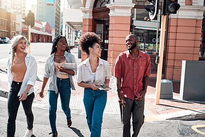 Buy stock photo Casual, diverse students walking in the city and chatting or having fun together in town during a university campus break. Cheerful, happy group of friends enjoying an outdoor meeting or hanging out.