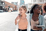 Laughing, happy and trendy students walking together in city after study session with tablet downtown. Stylish, cool and funky women and young friends bonding, embracing and hugging on a town street