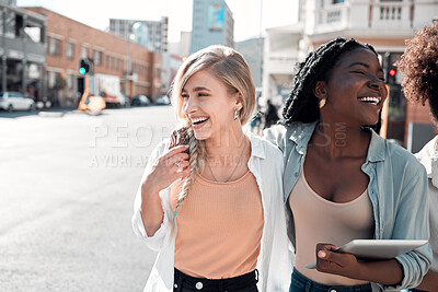Buy stock photo Laughing, happy and trendy students walking together in city after study session with tablet downtown. Stylish, cool and funky women and young friends bonding, embracing and hugging on a town street