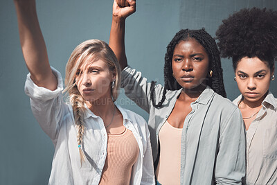 Buy stock photo Diverse female activists or protesters fists up fighting for freedom and human rights. A group of black lives matter supporters raising awareness for the political liberal movement and social justice