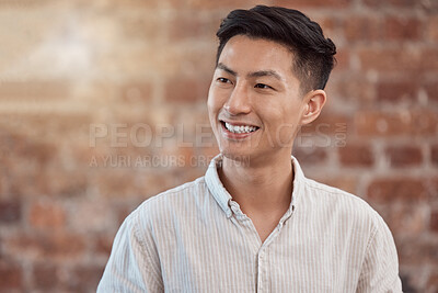 Happy, confident and smiling business man looking thoughtful while working in a creative startup agency. Cheerful, charming and positive designer feeling ambitious, optimistic and ready for success