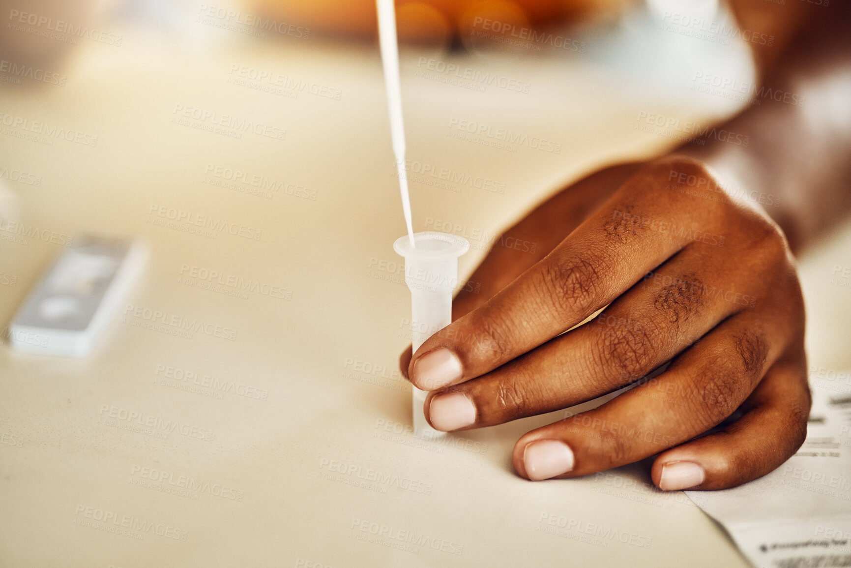 Buy stock photo Pandemic, corona and covid home test for virus, disease and illness during lockdown inside. Closeup of hand using medical tools for an antigen test on table, feeling scared, stressed and anxious