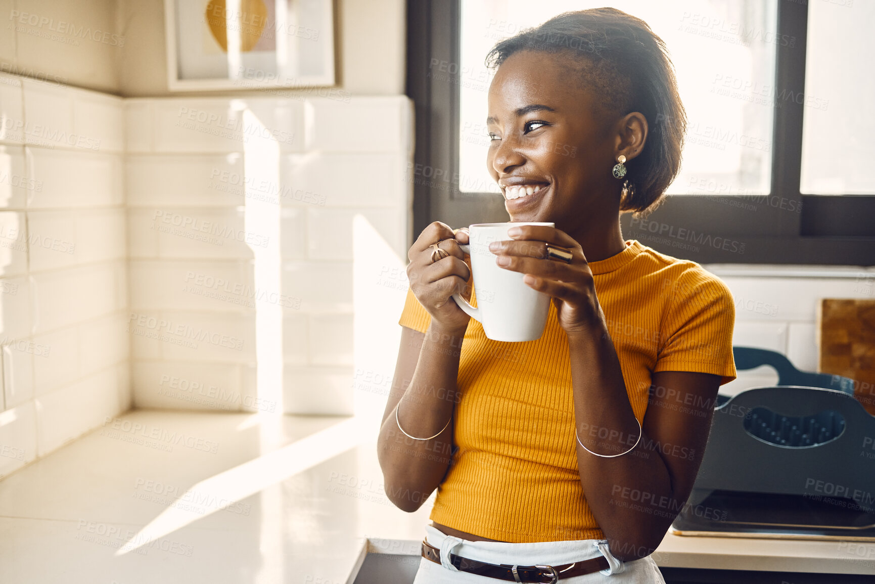 Buy stock photo Happy, thinking and relaxed woman drinking coffee on a break in bright sunny kitchen at home. One casual girl looking at the beautiful day while enjoying a drink, beverage or tea indoors and smiling