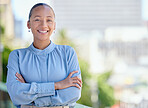 Happy, confident and smiling business woman standing with arms crossed outside at work alone. Portrait of the face of one cheerful, joyful and proud female corporate professional with arms folded 