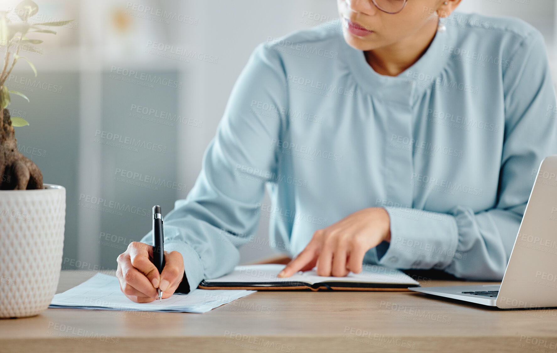 Buy stock photo Serious finance manager writing notes, planning and checking financial paperwork reports in office. Confident boss thinking, arranging tax deadlines or calculating business profit with laptop or book