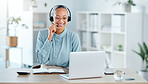 Happy call center agent calling, talking and doing online sales with a laptop and modern headset inside an bright office. Smiling ecommerce consultant promoting services in telemarketing company