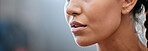 Closeup banner of a woman's face, mouth and chin with blurred copy space. Young female looking confident, focused and determined. Breathing deeply while getting ready and preparing for a challenge