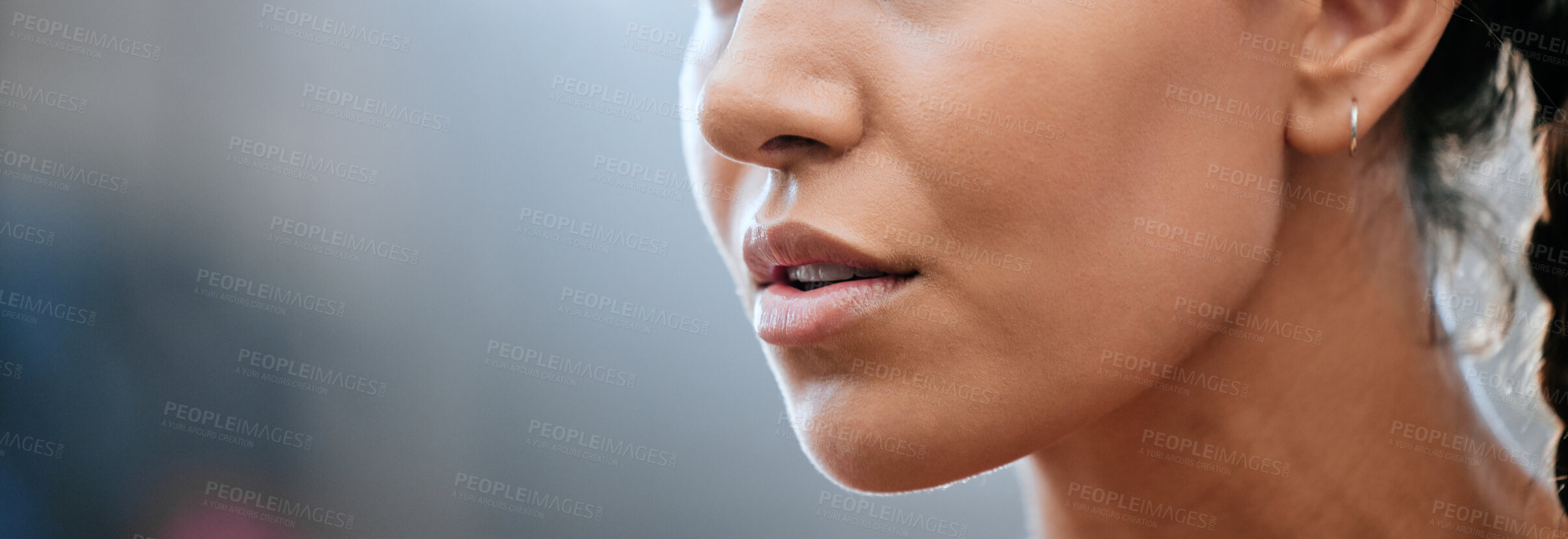 Buy stock photo Closeup banner of a woman's face, mouth and chin with blurred copy space. Young female looking confident, focused and determined. Breathing deeply while getting ready and preparing for a challenge