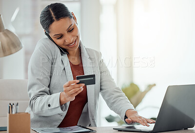 Black woman talking on phone call while shopping, paying and buying products and items online with a laptop in an office at work. One cheerful, joyful and content businessperson making a payment