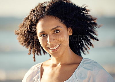 Buy stock photo Portrait of a happy young mixed trace woman face with a curly afro, beautiful hispanic woman enjoying some time at the beach. Closeup shot of a smiling young female having fun on a weekend 