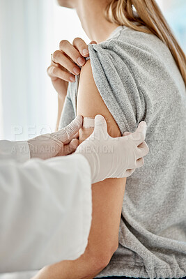 Buy stock photo Covid, vaccine and doctor applying plaster to patient after receiving medical treatment during pandemic. Close up of healthcare worker putting on medic patch after consulting a woman at hospital.