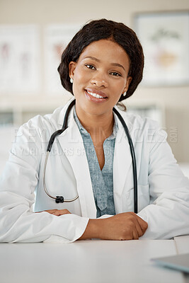 Buy stock photo Black woman doctor at her desk, happy and sitting at her office in a clinic or hospital. Success, work and a smile, young female healthcare professional or career medical worker, a leader in medicine
