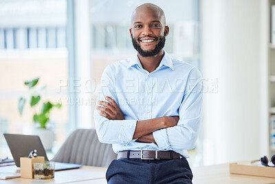Buy stock photo Confident business man standing with arms crossed in an office, looking proud and happy alone at work. Portrait of a smiling, cheerful and professional African male boss working in corporate