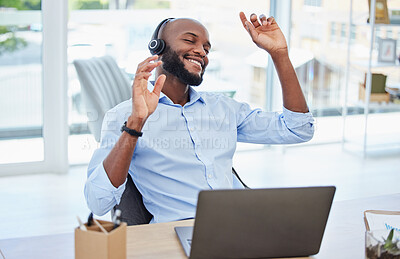 Buy stock photo Headphones, music and dancing creative with laptop listening and enjoying energetic dopamine songs to help him concentrate. Smiling, happy and motivated business man on a break and feeling inspired