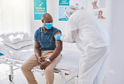 Patient getting covid vaccine, injection and cure from a doctor in a clinic. Man with plaster bandage on arm after flu jab, antiviral shot and health treatment to boost immunity and prevent illness
