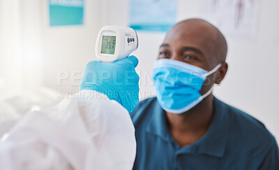 Buy stock photo Checking for covid, corona or fever with a patient wearing a mask for hygiene, sickness or flu symptoms in a health clinic. Medical doctor holding a thermometer to scan the temperature of a patient