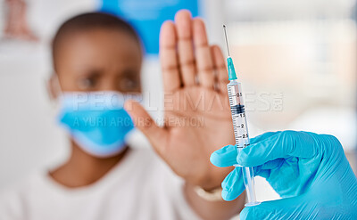 Buy stock photo Vaccine hesitancy, covid and female patient stopping doctor from giving the injection at the clinic. Woman refusing to take the vaccination while a healthcare worker prepares the needle and syringe. 