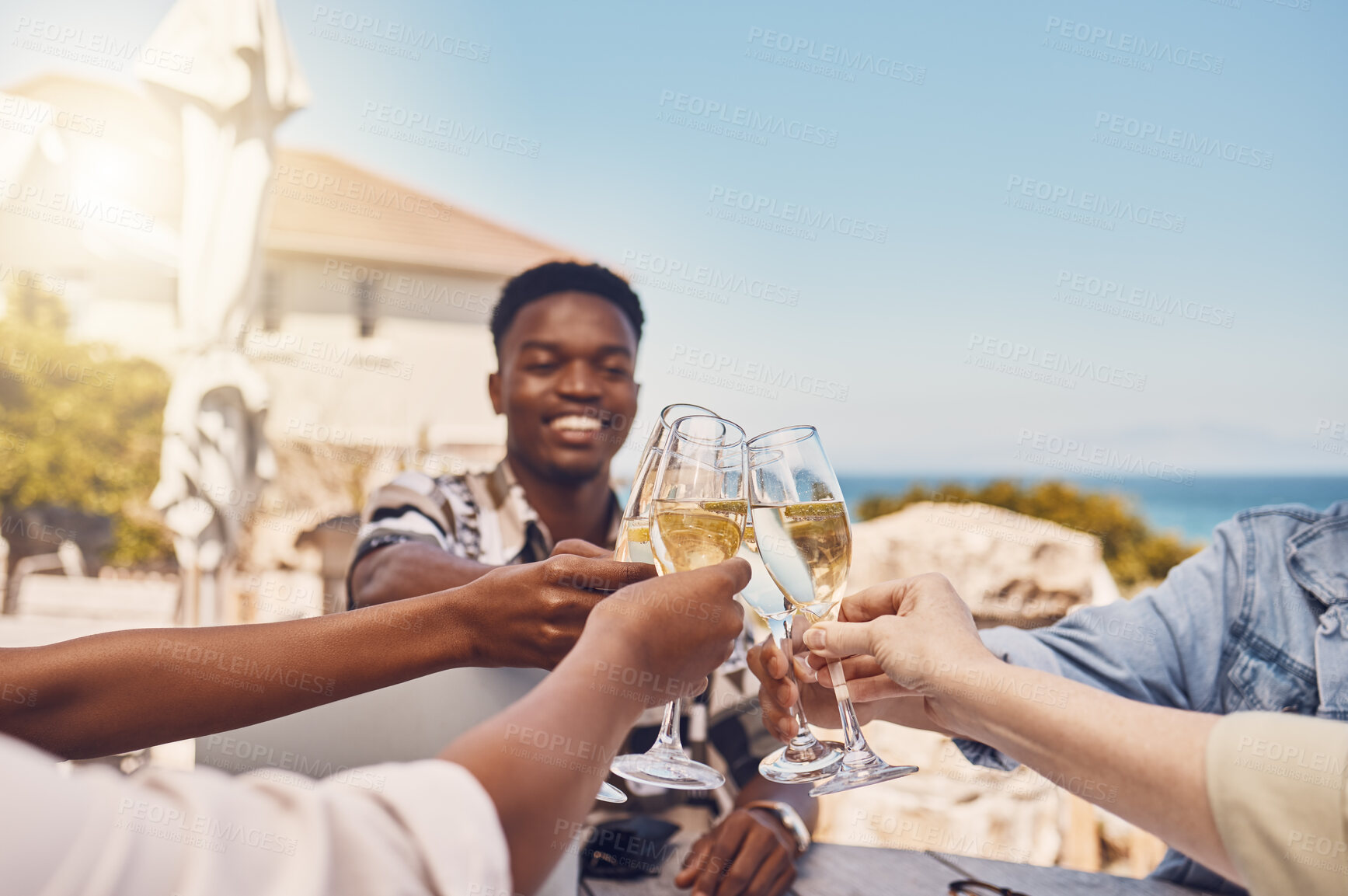 Buy stock photo Celebration, alcohol and friends toast with wine at an outdoor restaurant, happy and having fun. Young diverse people gathering to celebrate freedom, birthday, friendship or good news with cheers