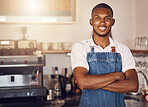 Business owner standing with arms crossed at a cafe, showing pride and success working at a restaurant. Portrait of a waiter, employee or worker giving smile at bakery, looking successful and happy