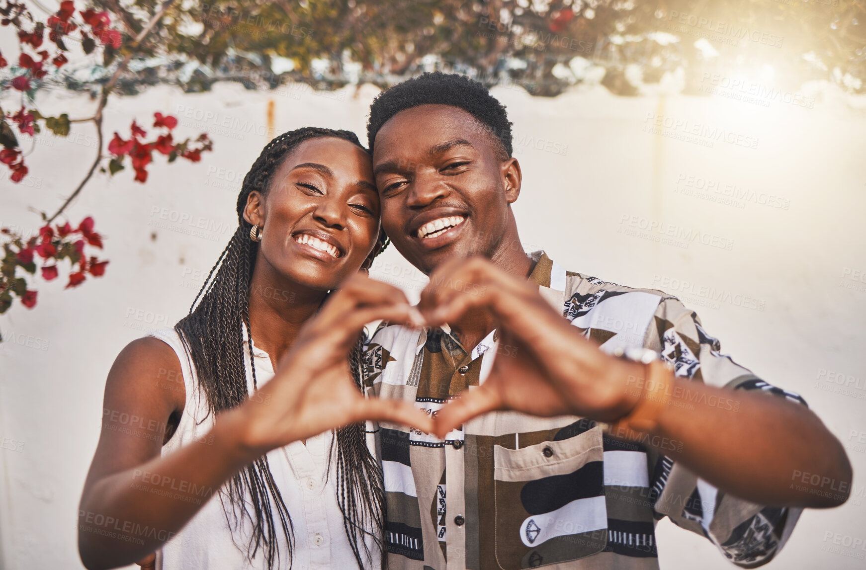 Buy stock photo Happy couple heart love sign with their hands posing for a picture or photo while on vacation or holiday. Portrait of a loving and young African American lovers having fun together smiling in joy