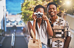 Travel, tourism and young black couple taking photo on a camera, having fun and walking in a city. African american boyfriend and girlfriend bonding, enjoying their relationship and journey together 